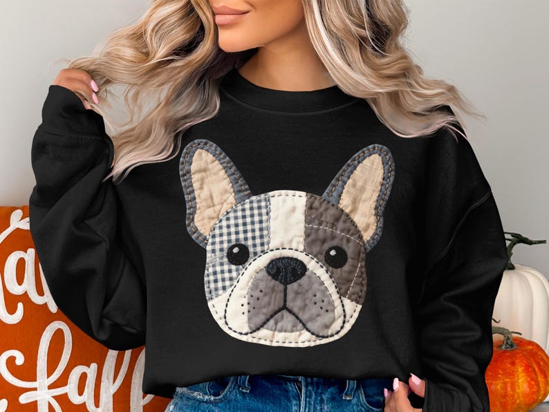 Black sweatshirt with a patchwork French bulldog graphic.