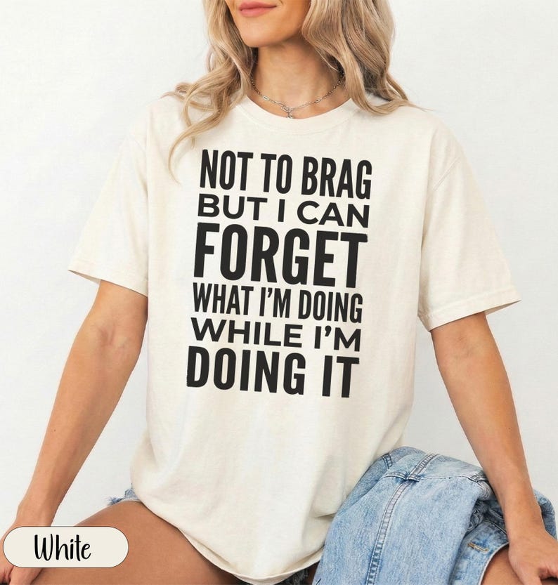 Cream t-shirt with "Forget What I'm Doing While I'm Doing It" text.