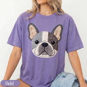 Purple t-shirt with a patch-style French bulldog graphic.