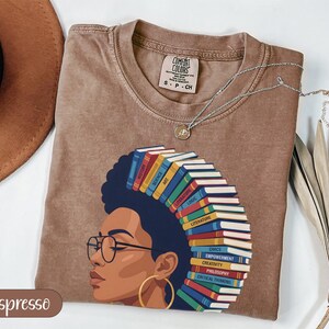 Brown t-shirt with woman reading stacked books; Espresso color.