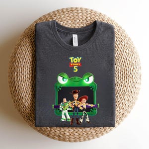 May include: A set of three ceramic mugs with a speckled, cream-colored glaze. Each mug features a different hand-painted floral design in shades of blue, green, and yellow. The mugs have a simple, rounded shape and a comfortable handle.