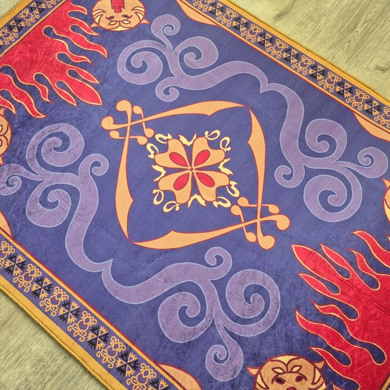 May include: A rectangular rug with a vibrant design. The rug features a deep blue background with swirling purple and orange patterns. Red flame-like shapes and a decorative border complete the design. The rug has a soft, plush texture.