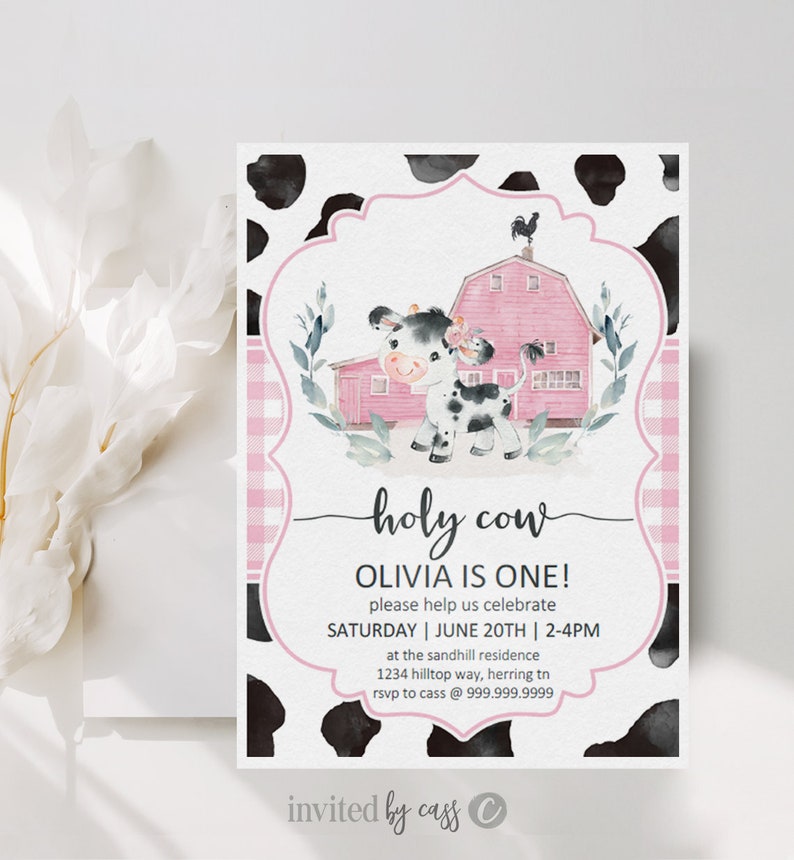May include: Pink and white cow with black spots, a pink barn, and a black rooster on top of the barn. The text "holy cow" is written in cursive. The text "Olivia is one!" is written in black. The text "Please help us celebrate" is written in black. The text "Saturday | June 20th | 2-4pm" is written in black. The text "at the sandhill residence" is written in black. The text "1234 hilltop way, herring tn" is written in black. The text "rsvp to cass @ 999.999.9999" is written in black. The text "invited by cass" is written in black. The text "C" is written in black.