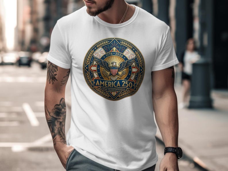 White t-shirt with "America 250 Semi-Quincentennial" emblem featuring fireworks and eagle.