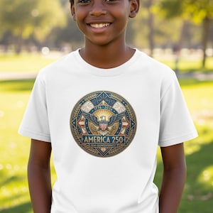 Child wearing a white t-shirt with a circular "America 250" emblem.
