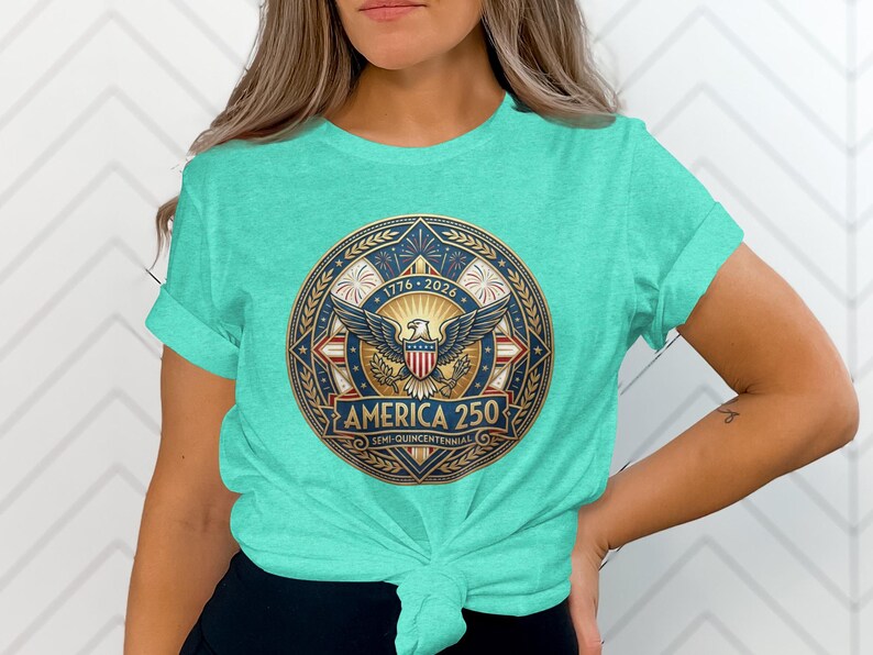 Turquoise t-shirt with "America 250" circular logo featuring eagle, stars, and stripes.