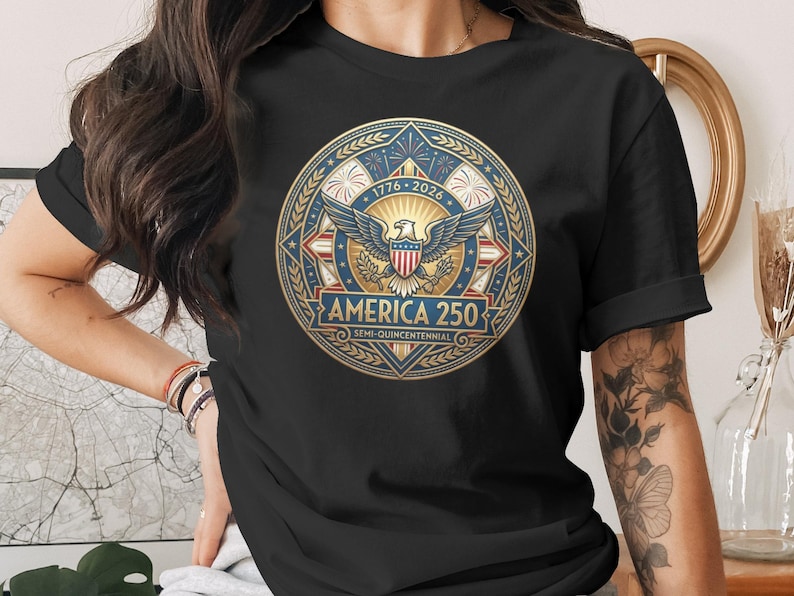 Black t-shirt with "America 250 Semi-Quincentennial" emblem featuring eagle and fireworks.
