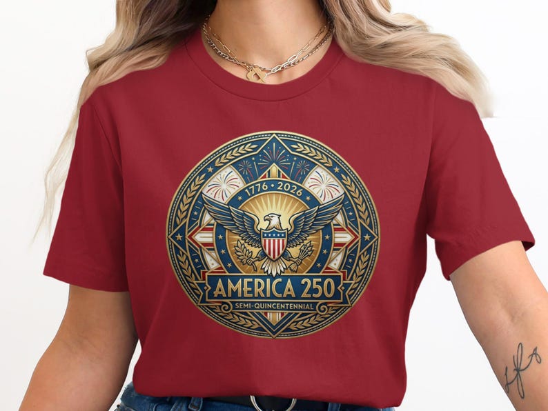 Red t-shirt with "America 250 Semi-Quincentennial" logo featuring an eagle and stars.