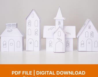 May include: Four white paper craft structures featuring black line drawings of windows, doors, and Halloween motifs including bats and a jack-o'-lantern face. These printable models are designed for assembly by cutting and gluing paper sheets.