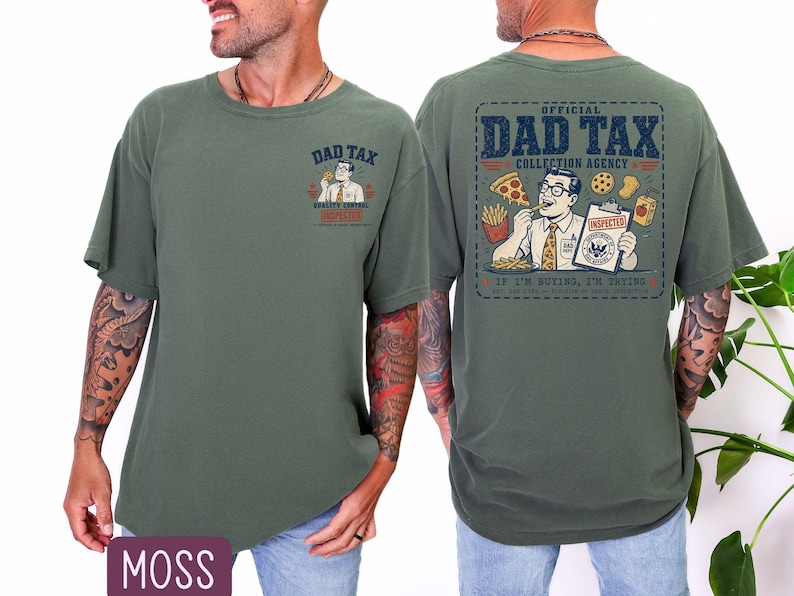 May include: Moss green t-shirt with a graphic on the front and back. The front graphic says "DAD TAX" with a cartoon image. The back graphic says "OFFICIAL DAD TAX COLLECTION AGENCY" with a cartoon image of a man eating food.