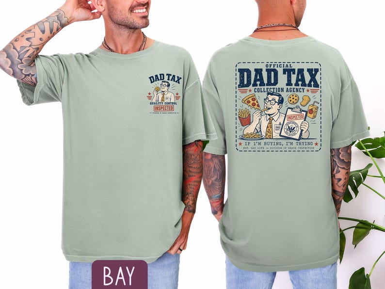 May include: A light green t-shirt with the text "DAD TAX" and a cartoon graphic on the front. The back of the shirt features a larger graphic with the words "OFFICIAL DAD TAX COLLECTION AGENCY" and the phrase "IF I'M BUYING, I'M TRYING."