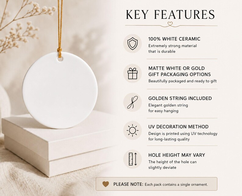 Puede incluir: Un adorno redondo de cer&aacute;mica blanca colgado de un cord&oacute;n dorado. El texto KEY FEATURES enumera: 100% WHITE CERAMIC, MATTE WHITE OR GOLD GIFT PACKAGING OPTIONS, GOLDEN STRING INCLUDED, UV DECORATION METHOD, HOLE HEIGHT MAY VARY. PLEASE NOTE: Each pack contains a single ornament.