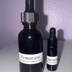 May include: Two dark amber glass dropper bottles of varying sizes, each featuring a white label with black text that reads FUNGICIDE and 3-5 DROPS PER 8-10oz OF WATER. The bottles are topped with black rubber dropper caps and glass pipettes.