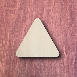 May include: A flat, light-coloured wooden cutout in the shape of an equilateral triangle with rounded corners. The surface of the wood shows a natural grain pattern, and the edges are smooth, creating a simple geometric form with a light tan hue.