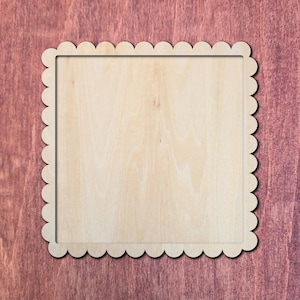 May include: A square wooden plaque featuring a scalloped edge border. The light-coloured natural wood surface is smooth and flat, framed by a decorative perimeter of rounded, semi-circular cutouts that create a continuous scalloped pattern.