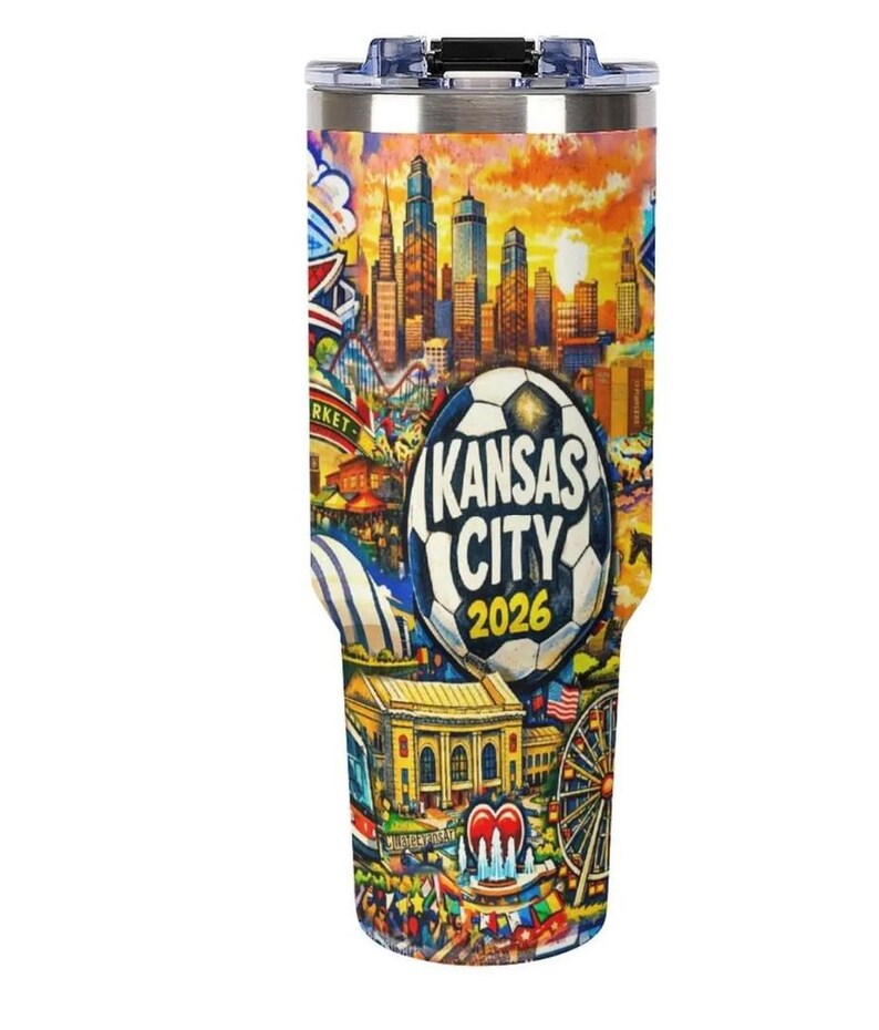 May include: A stainless steel travel tumbler featuring a colorful illustration of Kansas City landmarks and a soccer ball design. The text "Kansas City 2026" is prominently displayed on the tumbler, which is designed to keep beverages hot or cold.
