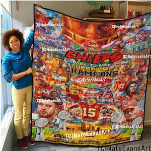 May include: A colorful blanket featuring a collage of football players and the text "CHIEFS BACK-TO-BACK SUPER BOWL CHAMPIONS." The design includes portraits of players, the Super Bowl trophy, and the team's logo. The blanket is held up by a person.