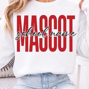 May include: White sweatshirt featuring the word "MASCOT" in large red block letters and "school name" in cursive script. The sweatshirt is a long-sleeved crew neck style.