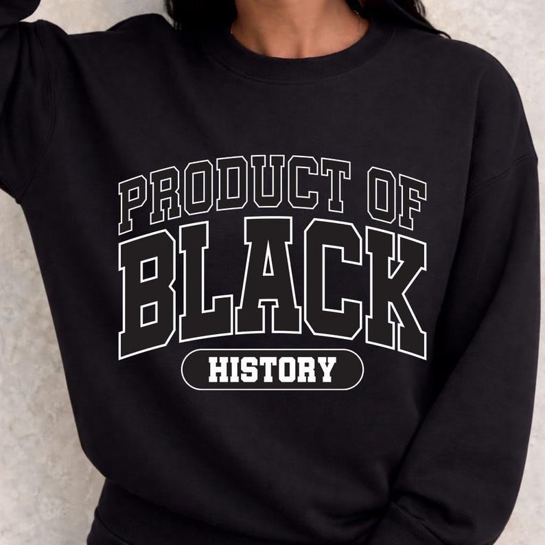 May include: Black sweatshirt with white text that reads "PRODUCT OF BLACK HISTORY" in a bold, collegiate-style font. The sweatshirt is a crew neck style, and the text is centered on the chest.