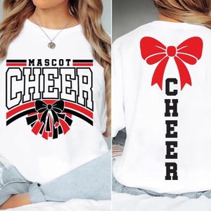 May include: White t-shirt with "MASCOT CHEER" in black and red block letters. A black bow with red accents is below the word "CHEER". The back of the shirt features a large red bow and the word "CHEER" in vertical black letters.