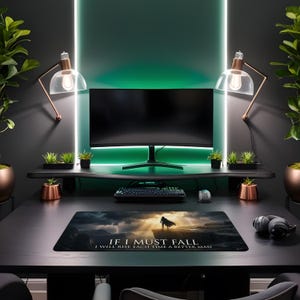 May include: A modern gaming setup featuring a curved monitor, keyboard, and mouse. A mousepad displays the text "IF I MUST FALL I WILL RISE EACH TIME A BETTER MAN". The desk is black, with copper-toned accents and green ambient lighting.
