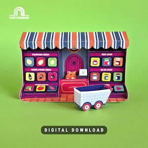 May include: A colorful paper grocery store with a striped awning, shelves labeled with "Pumpkin Seeds," "Sunflower Seeds," "Red Jams," "Blue Jams," and "Vegetables." A small cart sits in front. The text "DIGITAL DOWNLOAD" is at the bottom.