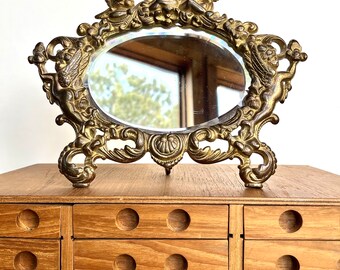 Antique Oval Vanity Mirror in Cherub Floral Frame