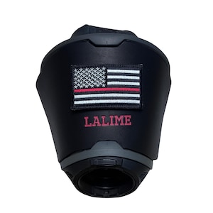 May include: A matte black tactical helmet cover featuring a rectangular embroidered patch of the American flag with a thin red line. The name LALIME is printed in red capital letters directly below the flag patch on the helmet surface.