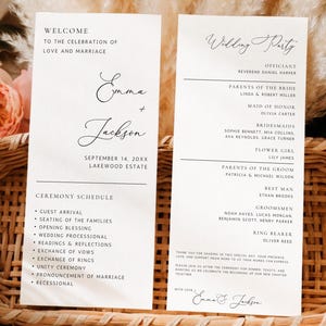 May include: Two white rectangular wedding programme cards with black text featuring the names Emma and Jackson, a ceremony schedule, and a wedding party list. The cards are displayed inside an oval woven wicker basket.