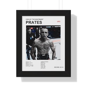 May include: Black framed print featuring UFC fighter Carlos Prates. The print includes Prates' name, nickname, and career statistics. The image shows Prates in the ring, with tattoos and the UFC logo visible. The print's dimensions are not specified.