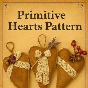 May include: Three brown heart-shaped ornaments with cream-colored lace and decorative accents. The ornaments are approximately 6.5 inches in height. The text "Primitive Hearts Pattern" is displayed at the top.