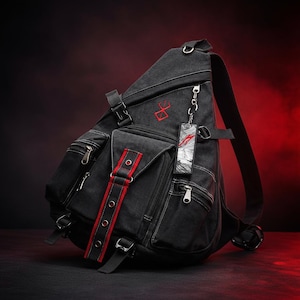 May include: Black canvas backpack with multiple zipped pockets and adjustable straps. Features a red accent stripe and a red emblem. Includes a keychain with a graphic design. The bag has a rugged, utilitarian design.