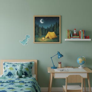 May include: A child's bedroom with a camping theme. A framed picture of a tent and campfire under a starry night sky hangs above a desk with a blue lamp and globe. A bed with a dinosaur-themed comforter and stuffed animal is in the foreground.