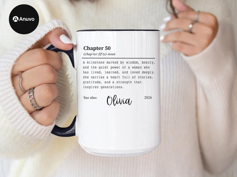 May include: White ceramic mug with a black rim and handle, featuring text that reads "Chapter 50" and a definition. The mug also includes the name "Olivia" and the year "2026".