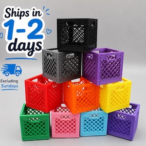 May include: A stack of ten small plastic storage crates in various colors including black, gray, purple, red, orange, yellow, green, pink, light blue, and violet. Each crate features a diamond-shaped lattice pattern and integrated handles.