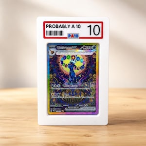 May include: A graded Umbreon EX trading card encased in a white plastic slab. The top label displays the text PROBABLY A 10 with a barcode and a 10 grade. The card features a colorful, holographic illustration of the Umbreon character with 280 HP.
