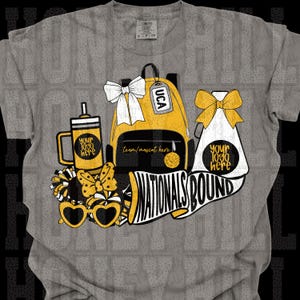 May include: Gray t-shirt with a graphic featuring a yellow backpack, megaphone, and sunglasses. The design includes the text "Nationals Bound" and space for a logo. A bow and pom-poms complete the design.