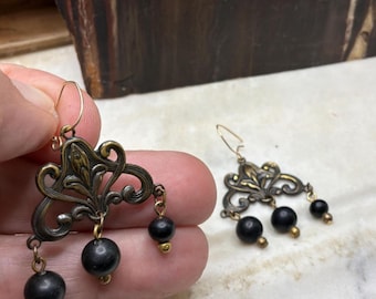 Antiqued Brass Fleur de Lis Chandelier Earrings, Art Nouveau Scrollwork, Black Bead Drop