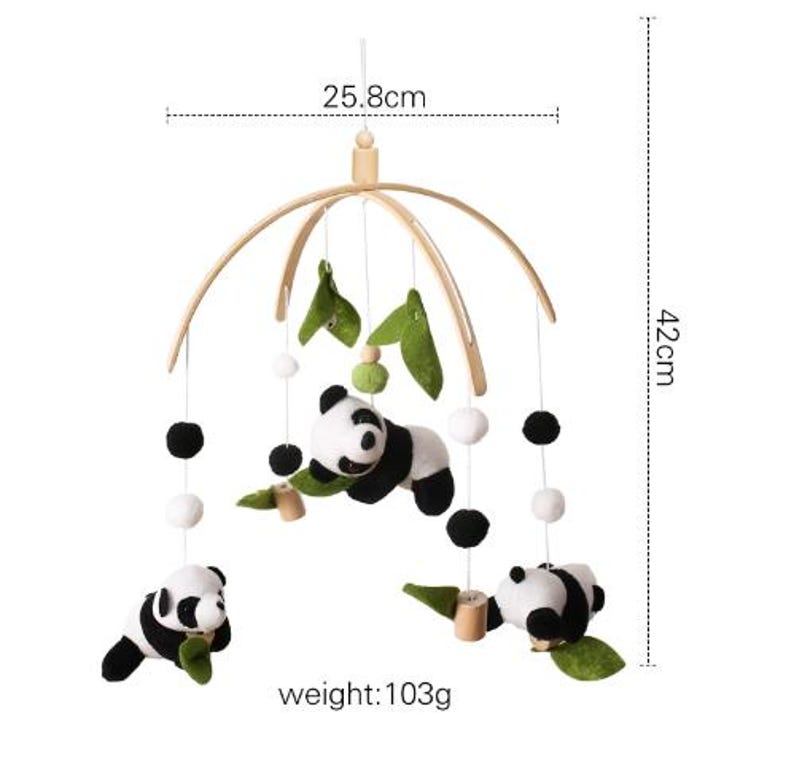 May include: A baby mobile featuring panda bears, green leaves, and white and black pom-poms. The mobile is 16.5 inches tall and 10.1 inches wide, with a weight of 3.6 ounces. The panda bears are black and white.