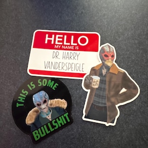 May include: A collection of stickers featuring the character Dr. Harry Vanderspeigle from the show Resident Alien. One sticker is a name tag that reads "HELLO MY NAME IS DR. HARRY VANDERSPEIGLE". Another sticker says "THIS IS SOME BULLSHIT".
