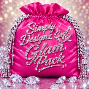 May include: A bright pink satin drawstring pouch featuring the text Simply Designz Co. Glam Pack in sparkling silver lettering. The bag is adorned with two thick, crystal-encrusted chain straps that end in matching crystal-covered tassels.