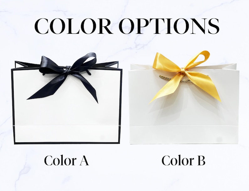 May include: Two white gift bags with black trim and bows. One bag has a black bow, and the other has a gold bow. The text "COLOR OPTIONS" is at the top, with "Color A" and "Color B" below the bags.