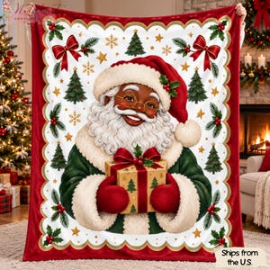 May include: A rectangular throw blanket featuring a central illustration of Santa Claus with a white beard, wearing a red hat and green coat, holding a gift box. The border is red with a scalloped edge, decorated with pine trees, holly, and bows.
