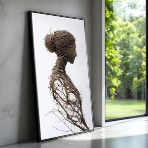 Puede incluir: Una impresión artística enmarcada que presenta un perfil lateral de una figura construida con ramitas marrones entrelazadas. La obra de arte está sobre un fondo blanco, con un marco negro. La pieza está apoyada contra una pared de mármol blanco.