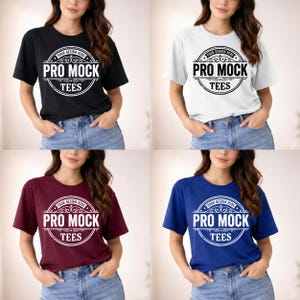 May include: Four t-shirts in black, white, burgundy, and blue. Each shirt features a circular design with the text "PRO MOCK TEES" and "YOUR DESIGN HERE" in a decorative frame. The shirts are short-sleeved and worn by a person.