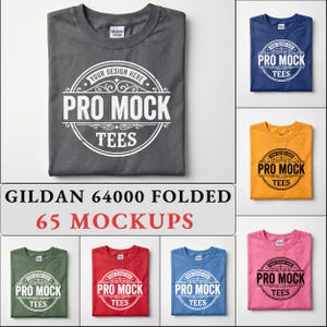 May include: A collection of seven folded Gildan 64000 t-shirts in charcoal, blue, yellow, green, red, light blue, and pink. Each shirt features a circular graphic with the text YOUR DESIGN HERE, PRO MOCK, and TEES in a decorative frame.