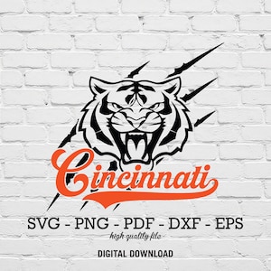 May include: Black and white tiger head graphic with the word "Cincinnati" in orange script. The design includes claw marks and file type options: SVG, PNG, PDF, DXF, and EPS. The text "high quality file" and "DIGITAL DOWNLOAD" are also included.