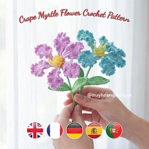 May include: A set of three ceramic mugs with a speckled, cream-colored glaze. Each mug features a different hand-painted floral design in shades of blue, green, and yellow. The mugs have a simple, rounded shape and a comfortable handle.