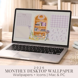 May include: A laptop displays a desktop wallpaper with a watercolor illustration of a bookshelf, bicycle, and calendar. The wallpaper has a soft, pastel color scheme. Text at the bottom reads "2026 MONTHLY DESKTOP WALLPAPER Wallpapers + Icons | Mac & PC". A croissant and coffee cup are on the table.