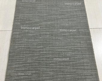 Tapete de lã feito à mão: textura moderna com corte em laço, cor sólida